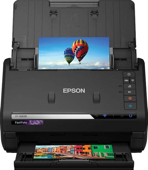 Epson FastFoto FF-680W Fast auto-feeder scanner; Scan up to 30 photos in 30 seconds; Auto crop, rotate and enhance colours and contrast; Creates shareable JPEGs or large TIFFs for maximum image quality; Set automatic upload to Dropbox and Google Drive; Takes photos 9x13cm up to 21x91cm; Skip blank page, Punch holes removal, Automatic de-skew, Auto-rotation, Advanced cropping feature for Auto size, Automatic Folder Creation, Scan to Cloud Storage; Warranty 1 Year Carry-in