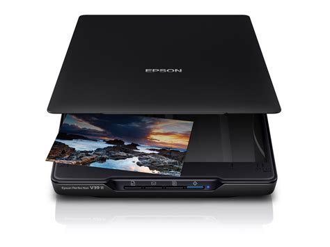 Epson Perfection V39II Photo and document scanner; High resolution 4800dpi scanning; Power and connectivity via Micro USB; Integrated stand for upright scanning; Four one-touch buttons; Ensure the best quality scans and store and share your photos online; RGB colour dropout, Automatic area segmentation, Text enhancement, Scan to Cloud Storage, Scan to Selected Photo Sharing Websites, 4 push buttons (PDF, Send, Copy, Start), Integrated stand for upright scanning; Warranty 1 Year Carry-In